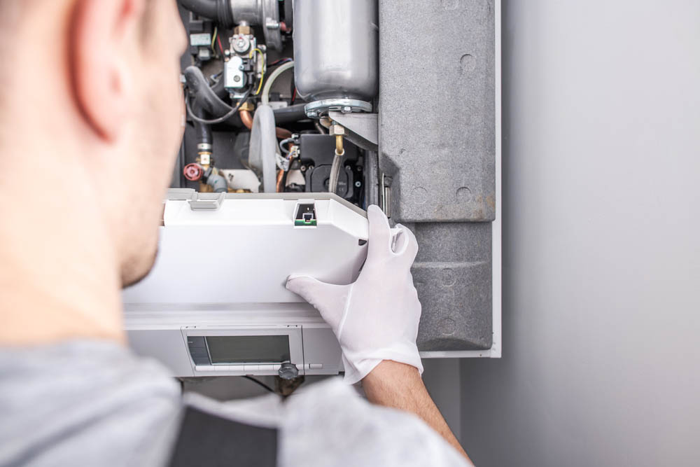 Technician Fixing Central Heating Furnace System